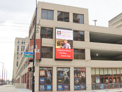 My new parking garage is better than the old one because it shows my face on a giant screen.